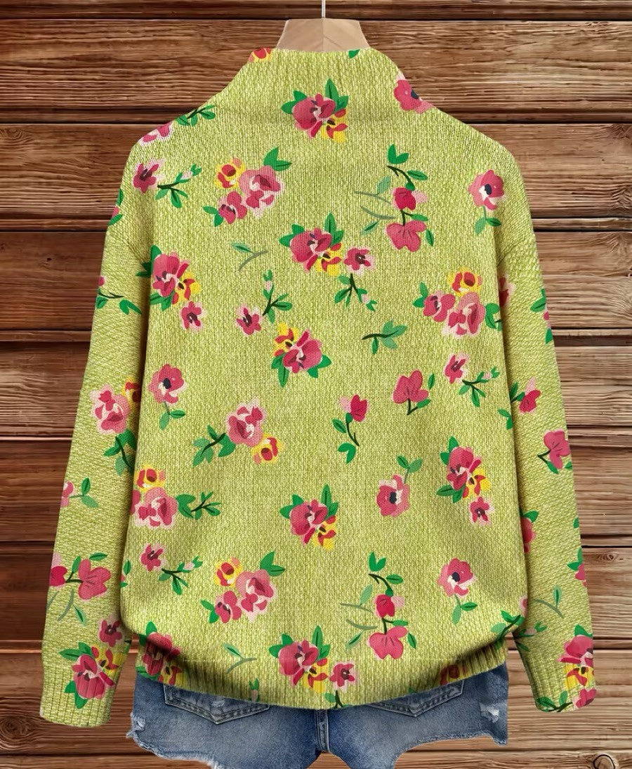 Birgit gebreid vest met bloemen op groene achtergrond en rits